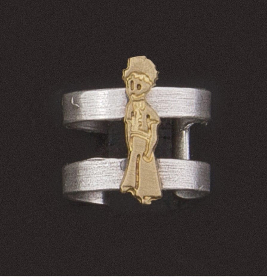 Silver ring with little prince design in gold color