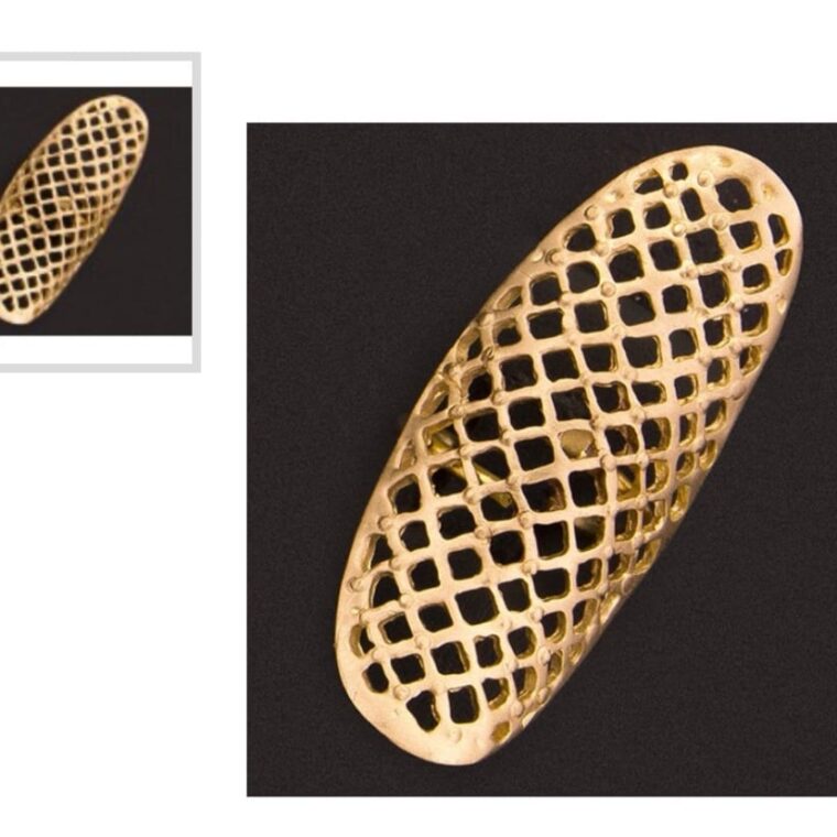 Handmade ring with perforated brass pattern